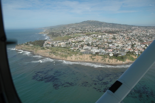 Arial Image of the Palos Verdes Peninsula and Kelp Forrests reaching the surface of the water. Phot Credited to: Geology Department at Cal State University of Long Beach